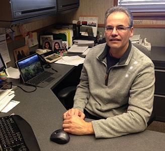 Randy Meyer sits at his desk at ITW Heartland